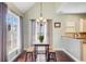 Charming breakfast nook bathed in natural light with a wooden table and bench seating at 173 Silver Cypress Cir, Summerville, SC 29485
