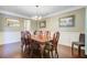 Formal dining room showcasing hardwood floors, wainscoting, and elegant decor at 173 Silver Cypress Cir, Summerville, SC 29485