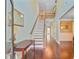 Elegant foyer with hardwood floors, a staircase, and abundant natural light at 173 Silver Cypress Cir, Summerville, SC 29485