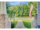 Charming porch with an American flag, view of the street, and well-maintained landscaping at 173 Silver Cypress Cir, Summerville, SC 29485