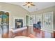 Comfortable living room with fireplace, hardwood floors, and access to the outdoors at 173 Silver Cypress Cir, Summerville, SC 29485