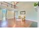 Open-concept living room with high ceilings and wood floors with a staircase visible at 173 Silver Cypress Cir, Summerville, SC 29485