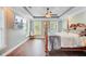 Elegant main bedroom with tray ceilings, hardwood floors, and plenty of natural light at 173 Silver Cypress Cir, Summerville, SC 29485