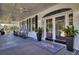 Welcoming front porch with rocking chairs and elegant glass entry doors at 173 Silver Cypress Cir, Summerville, SC 29485