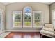 Bright sunroom with large windows offers serene views and lots of natural light at 173 Silver Cypress Cir, Summerville, SC 29485