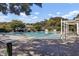 Tranquil community pool showcasing lounge chairs, clear blue water, and mature trees surrounding the area at 173 Silver Cypress Cir, Summerville, SC 29485
