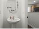 Powder room featuring a pedestal sink, modern fixtures, and ample natural light at 190 Darcy Ave, Goose Creek, SC 29445