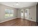 Bedroom featuring hardwood floors, a window, and access to a patio at 190 Darcy Ave, Goose Creek, SC 29445