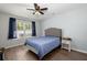 Bedroom features hardwood floors, a ceiling fan, and a queen bed at 190 Darcy Ave, Goose Creek, SC 29445