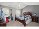 Spacious bedroom with a ceiling fan, window, and hardwood furniture at 190 Darcy Ave, Goose Creek, SC 29445