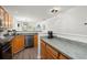 Well-lit kitchen with wood cabinets, modern appliances, and open view to other living spaces at 190 Darcy Ave, Goose Creek, SC 29445