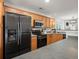 Modern kitchen with stainless steel appliances, black oven, wood cabinets and ample counter space at 190 Darcy Ave, Goose Creek, SC 29445