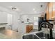 Bright kitchen featuring wood cabinets, stainless steel appliances, and adjacent powder room at 190 Darcy Ave, Goose Creek, SC 29445