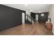Open living area with hardwood floors and dark walls at 190 Darcy Ave, Goose Creek, SC 29445