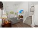 Vaulted ceiling living room featuring hardwood floors, stairs with white railings, and a mounted TV at 190 Darcy Ave, Goose Creek, SC 29445