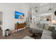 Cozy living room featuring hardwood floors, vaulted ceilings, and staircase to upper level at 190 Darcy Ave, Goose Creek, SC 29445