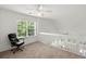 Bright loft with a ceiling fan and a window overlooking the front yard at 190 Darcy Ave, Goose Creek, SC 29445