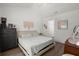 Bright bedroom featuring hardwood floors, a comfortable bed, and modern decor at 190 Darcy Ave, Goose Creek, SC 29445