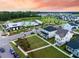 Aerial view of homes in a community, with a recreation center including pool and playground at 203 Symphony Ave, Summerville, SC 29486