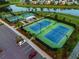 Aerial view of community tennis courts with blue and green courts and a shelter at 203 Symphony Ave, Summerville, SC 29486