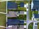 Aerial view of house rooftops, backyards, driveways, and the street of a new neighborhood at 203 Symphony Ave, Summerville, SC 29486