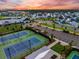 Beautiful sunset view of community tennis courts, clubhouse and neighborhood at 203 Symphony Ave, Summerville, SC 29486