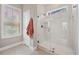 Clean bathroom with tiled shower, glass door, and neutral tones at 203 Symphony Ave, Summerville, SC 29486