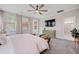 Spacious bedroom featuring a ceiling fan, TV, and bathroom access at 203 Symphony Ave, Summerville, SC 29486