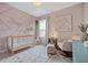 Charming Bedroom with decorative wall, crib, rocking chair and patterned rug at 203 Symphony Ave, Summerville, SC 29486