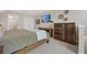 Cozy bedroom with rustic wood furniture and wall-mounted TV for relaxing evenings at 203 Symphony Ave, Summerville, SC 29486