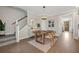 Dining room features wooden floors, statement light fixture, modern buffet with a decorative mirror at 203 Symphony Ave, Summerville, SC 29486