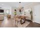 Beautiful dining room with a wood table, matching chairs, and a decorative pendant light fixture at 203 Symphony Ave, Summerville, SC 29486