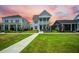 Charming two-story home with a double front porch and manicured lawn at 203 Symphony Ave, Summerville, SC 29486