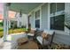 Cozy front porch with charming seating and decorative accents at 203 Symphony Ave, Summerville, SC 29486