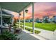 Inviting front porch with comfortable seating and hanging plants at 203 Symphony Ave, Summerville, SC 29486