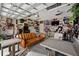 Finished garage with seating area, TV, bar, and sports memorabilia on the walls at 203 Symphony Ave, Summerville, SC 29486
