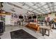 Finished garage with seating area, TV, bar, and sports memorabilia on the walls at 203 Symphony Ave, Summerville, SC 29486