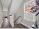 Hallway with wood floors and stairway, showing the home's interior design at 203 Symphony Ave, Summerville, SC 29486