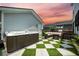 Outdoor hot tub and firepit seating create a relaxing outdoor space at 203 Symphony Ave, Summerville, SC 29486