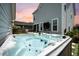 Relaxing hot tub in a beautifully landscaped backyard, creating a private outdoor oasis at 203 Symphony Ave, Summerville, SC 29486