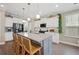 Stylish kitchen features granite countertops, stainless steel appliances, and bar stool seating at 203 Symphony Ave, Summerville, SC 29486