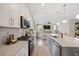 Modern kitchen with white cabinets, granite countertops, stainless steel appliances and an island at 203 Symphony Ave, Summerville, SC 29486