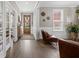 Inviting living room features hardwood floors, modern decor, and a light and airy feel at 203 Symphony Ave, Summerville, SC 29486