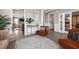 Bright living space with a comfortable chair, modern decor, and access to other rooms at 203 Symphony Ave, Summerville, SC 29486