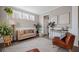 Well-decorated living area with cozy seating, a modern rug, and bright natural light at 203 Symphony Ave, Summerville, SC 29486