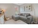 Cozy living area features a comfortable sectional sofa, stylish floor lamp, and decorative wall art at 203 Symphony Ave, Summerville, SC 29486
