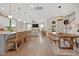 Open floor plan with a kitchen island, dining area, and living room with plenty of natural light at 203 Symphony Ave, Summerville, SC 29486