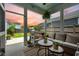 Inviting screened patio with comfortable seating, potted plants and outdoor grill, perfect for entertaining at 203 Symphony Ave, Summerville, SC 29486
