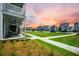 Street view showcasing sidewalks, multiple homes, and lush landscaping at 203 Symphony Ave, Summerville, SC 29486