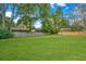 Sprawling backyard featuring a well-manicured lawn, wooden fences, and mature trees at 204 Foxborough Rd, Goose Creek, SC 29445
